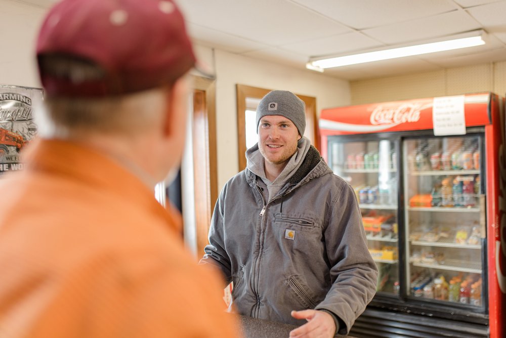 Cole Sonne talking to a patron at Storla Station.