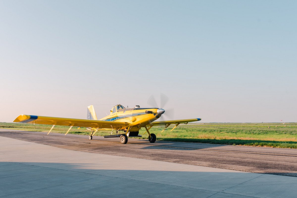 A yellow helicopter landing.