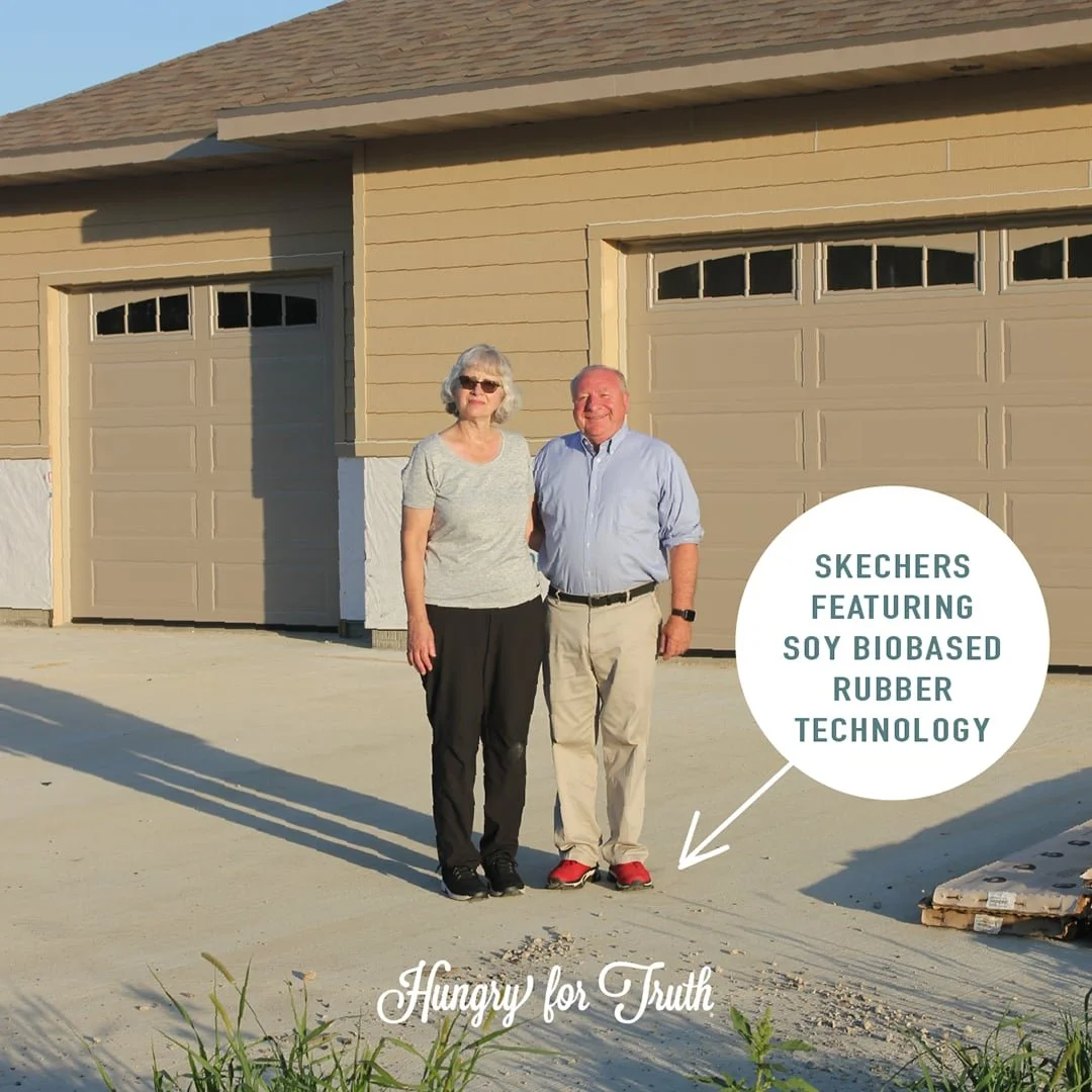 Jerry and his wife outside their home. Jerry is wearing skechers made from soy biobased rubber technology.
