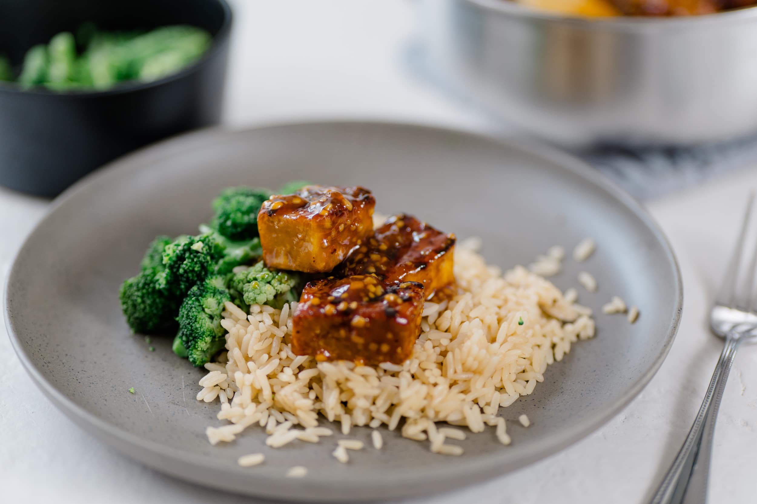 Honey glazed tofu on a bed of rice and broccoli