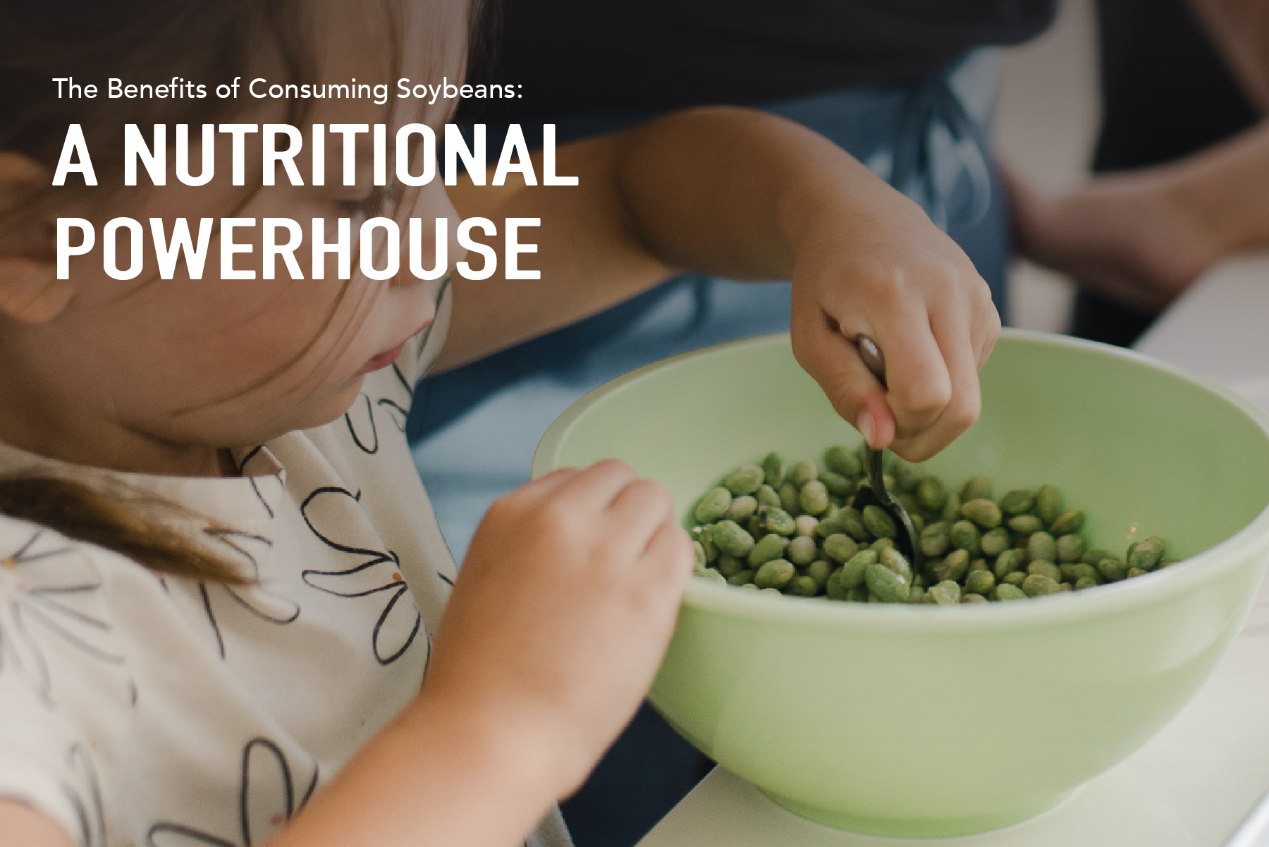 A child scooping up soybeans from a bowl.