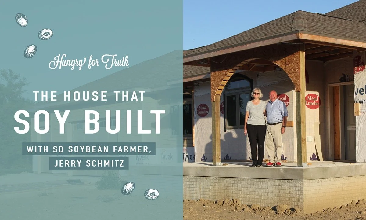 Jerry Schmitz and his wife outside a house being built