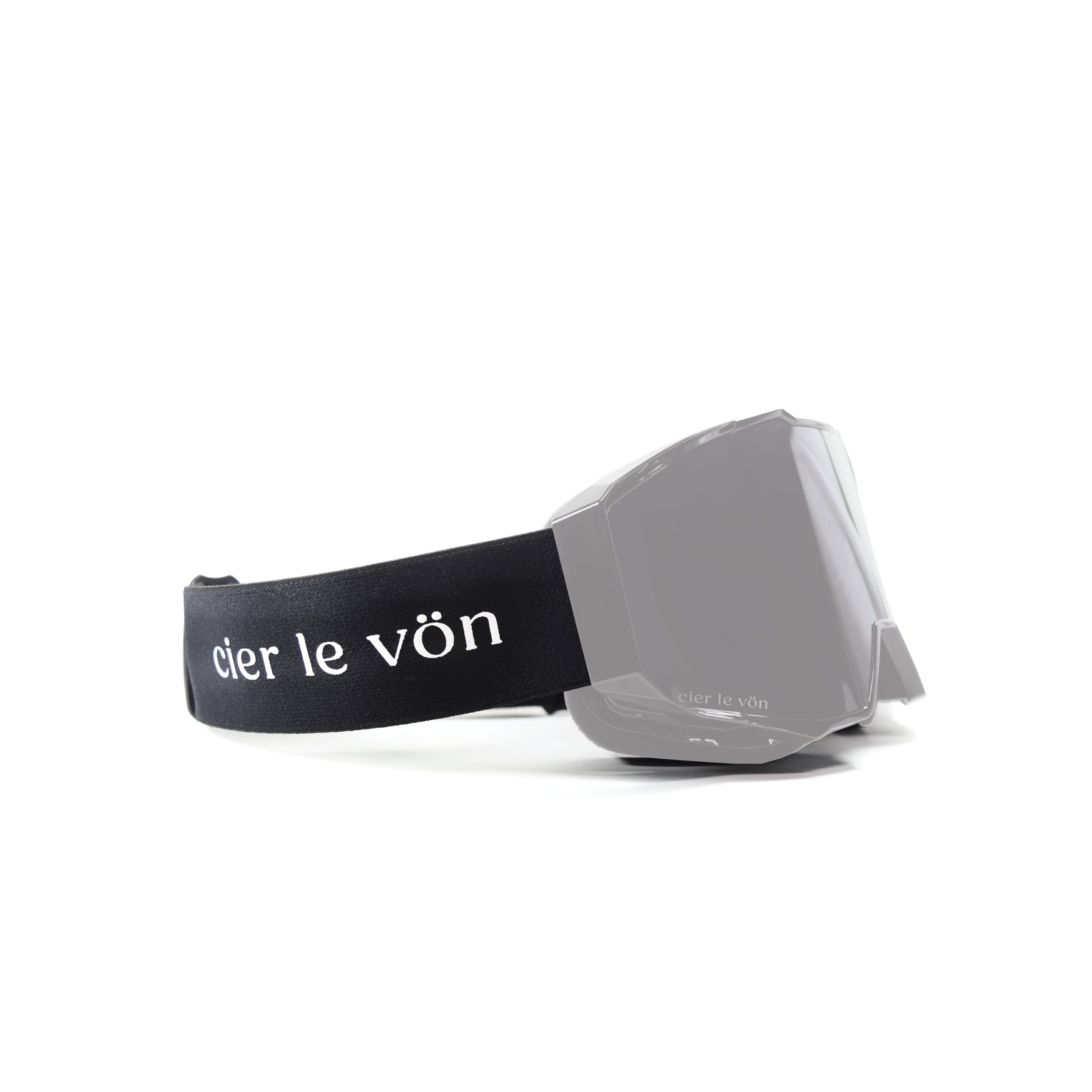 A gray ski or snowboard goggle with a black strap that has white lettering reading 'cier le vön' on a white background.