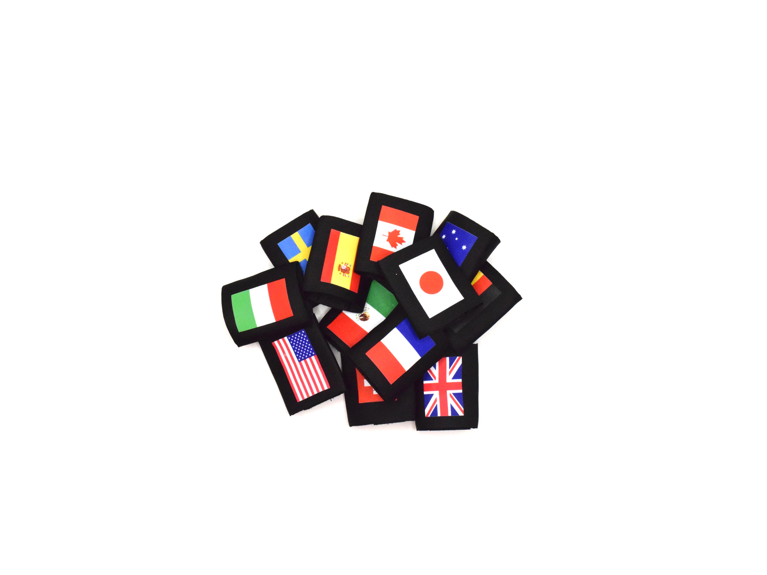 A collection of CLV Customs Nationality Bands with flags of various countries, arranged in a pile on a white background. The flags include those of Italy, Sweden, Spain, Canada, Japan, Australia, the United States, the United Kingdom, and others.
