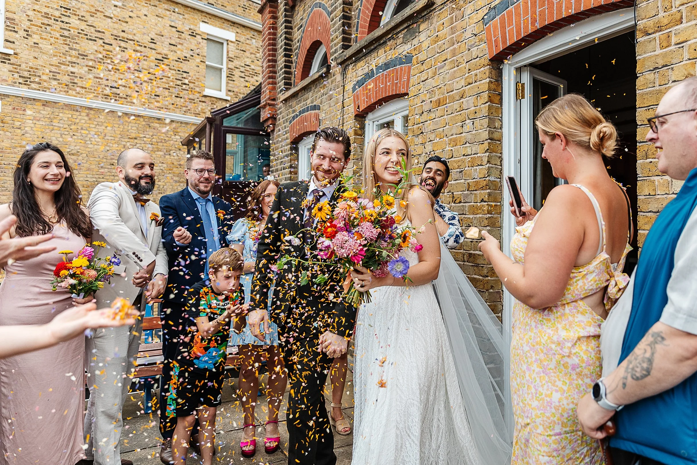Couple celebrating their wedding day at the London Rowing Club, Putney.