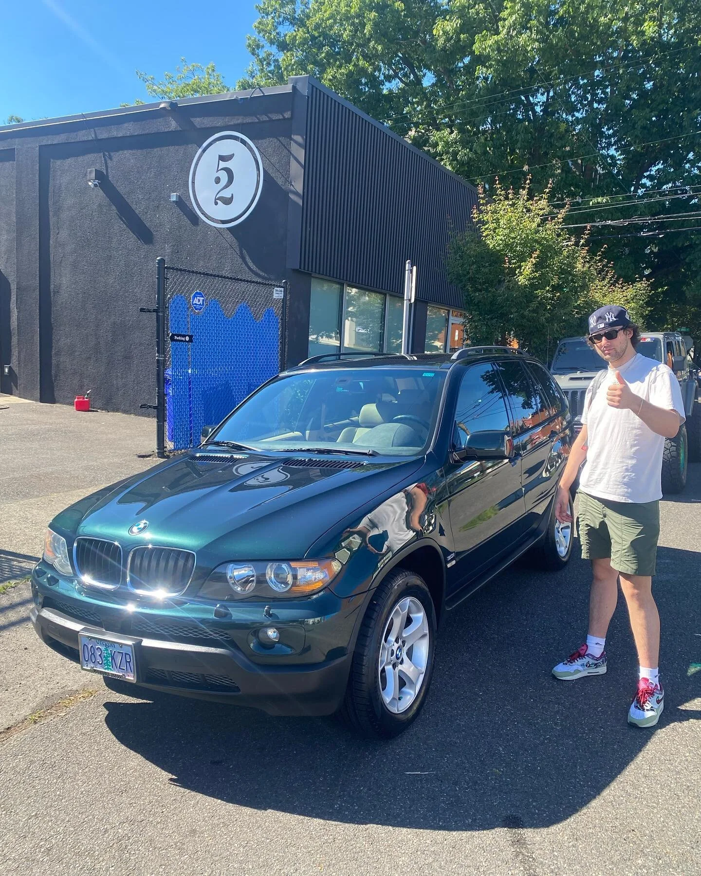 Paint Enhancement, Headlight restoration, Interior service for this green X5