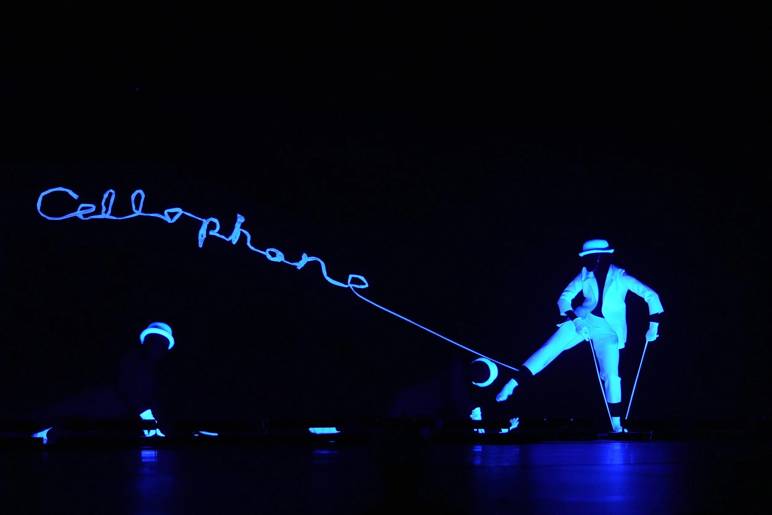 Creative dance performance photography featuring dramatic lighting, movement, and stage effects.