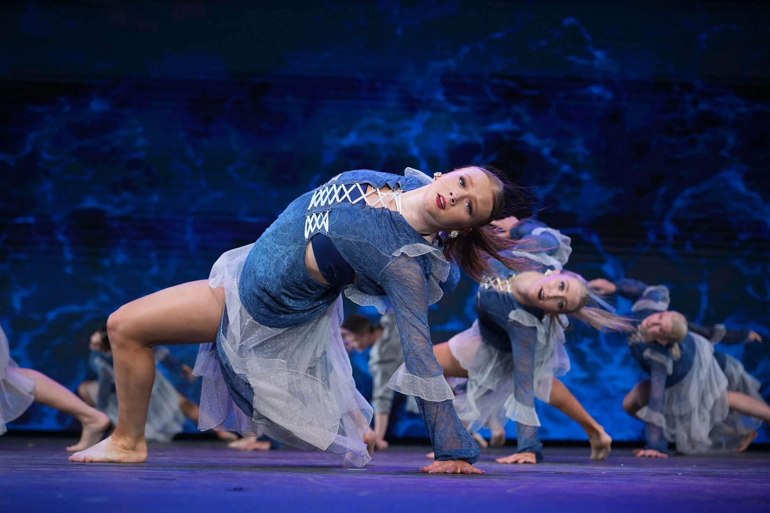 High-energy contemporary dance photography capturing movement, emotion, and choreography on stage.