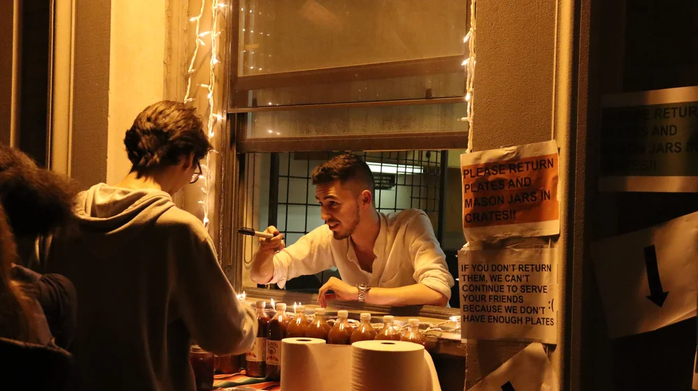 Gustavo taking orders at the window