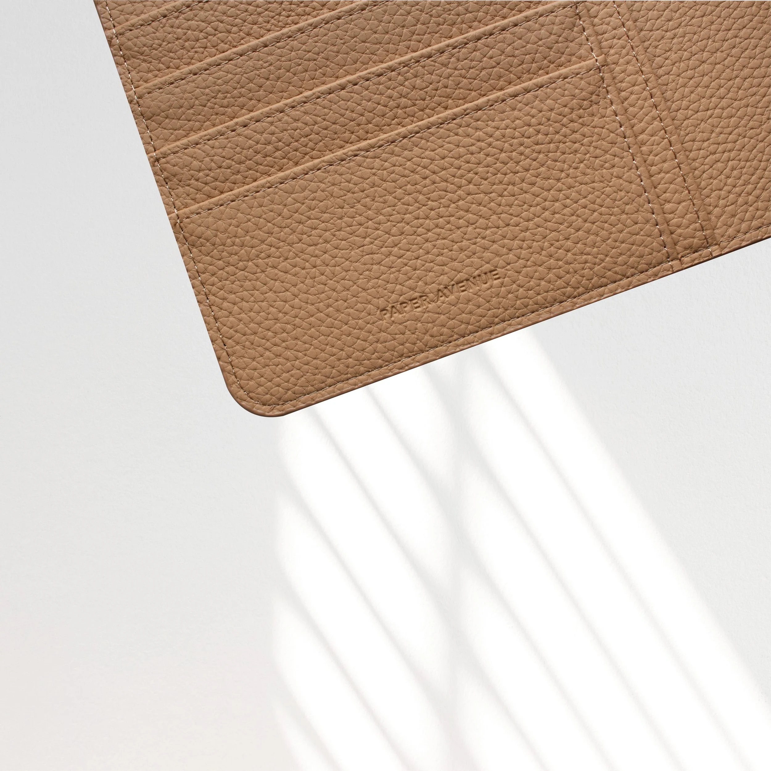 Vegan-Leather-Folio-Cover-Tan-Embossed-Logo.jpg