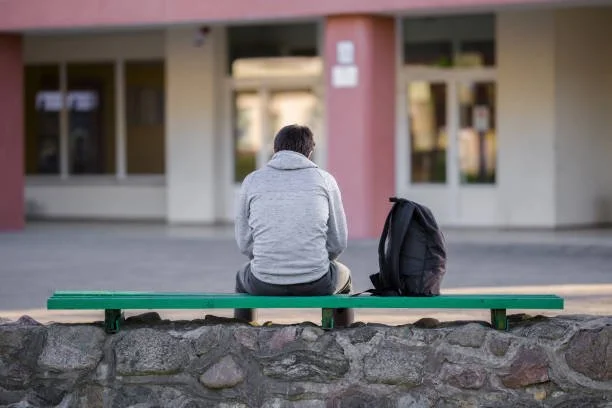 Teen in a calm outdoor setting representing emotional support and self-reflection