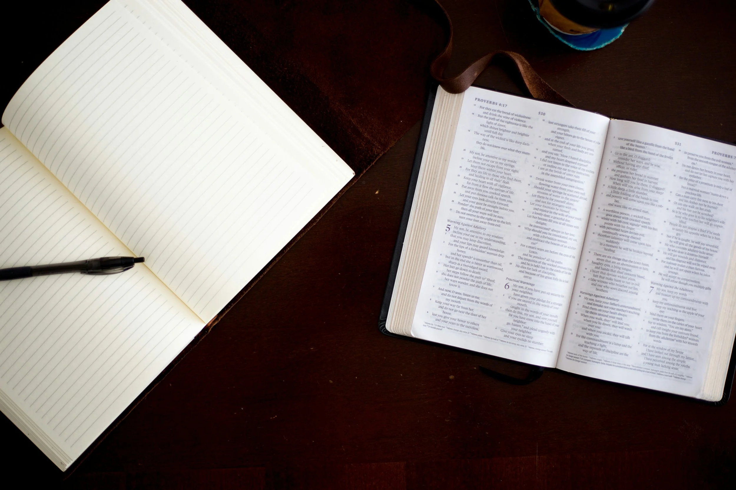 Journal and pen, representing reflection and self-understanding