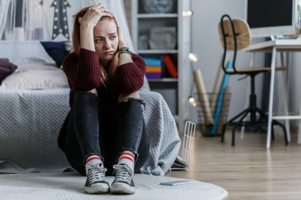 Teen experiencing emotional stress during a quiet reflective moment