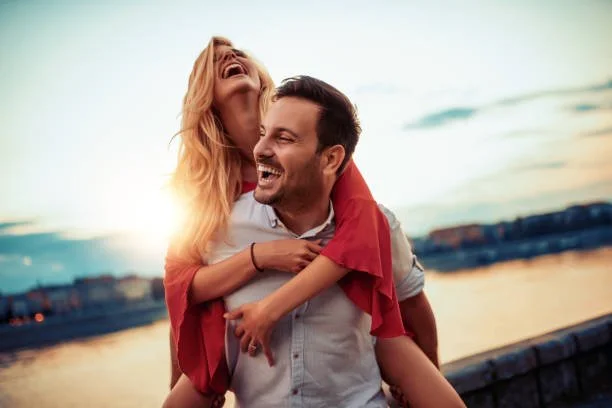 Couple sharing a lighthearted and connected moment together outdoors