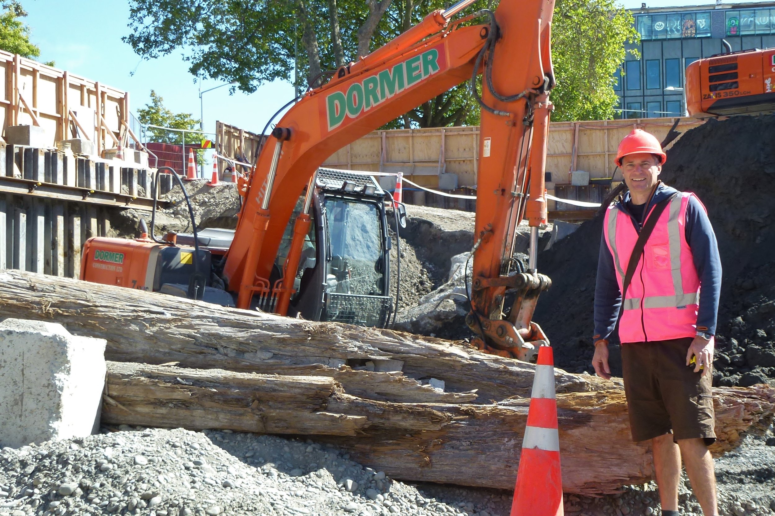 Andrew Davies beside rescued totara logs.JPG