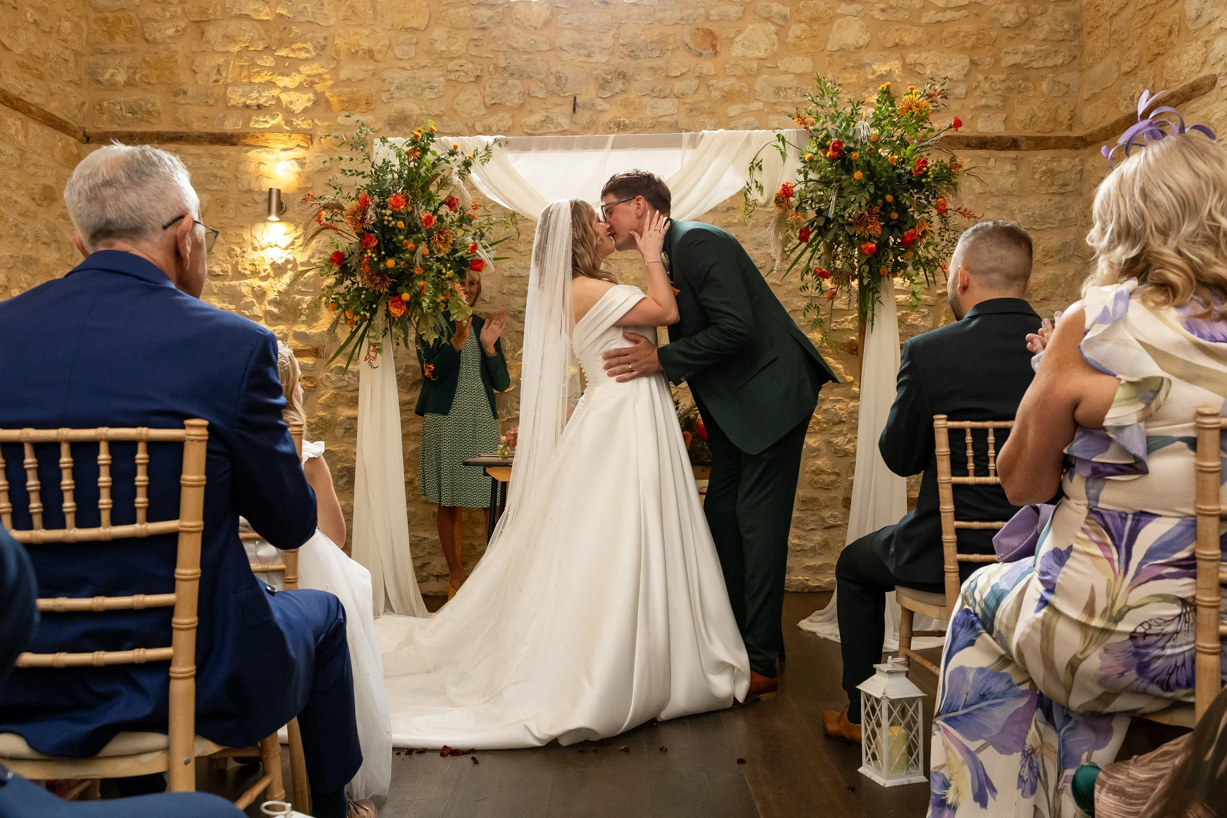 Bride and groom share thier first kiss at thier  Relaxed and fun wedding at Huntsmill Farm