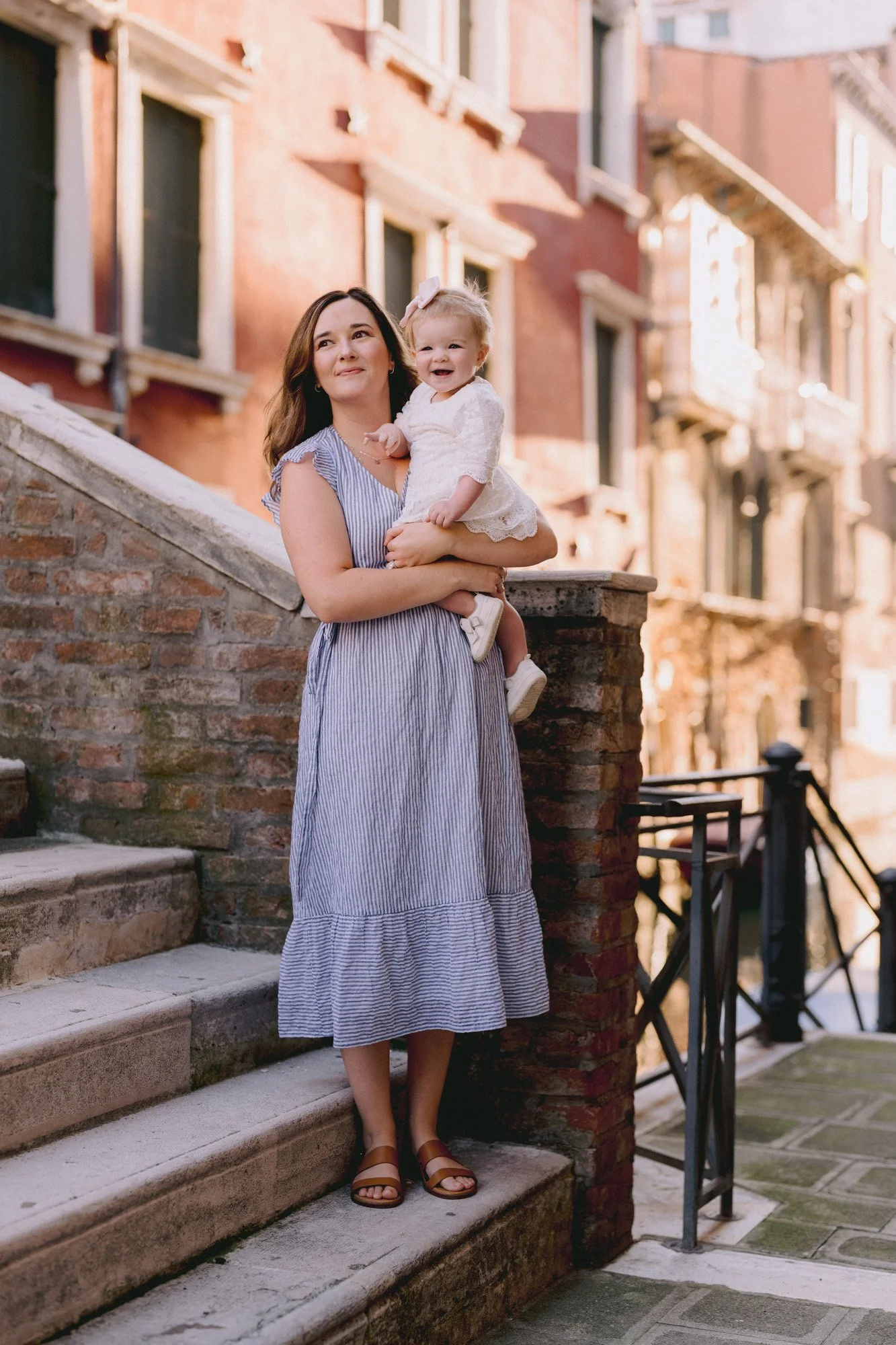 Mother and baby on Venetian bridge