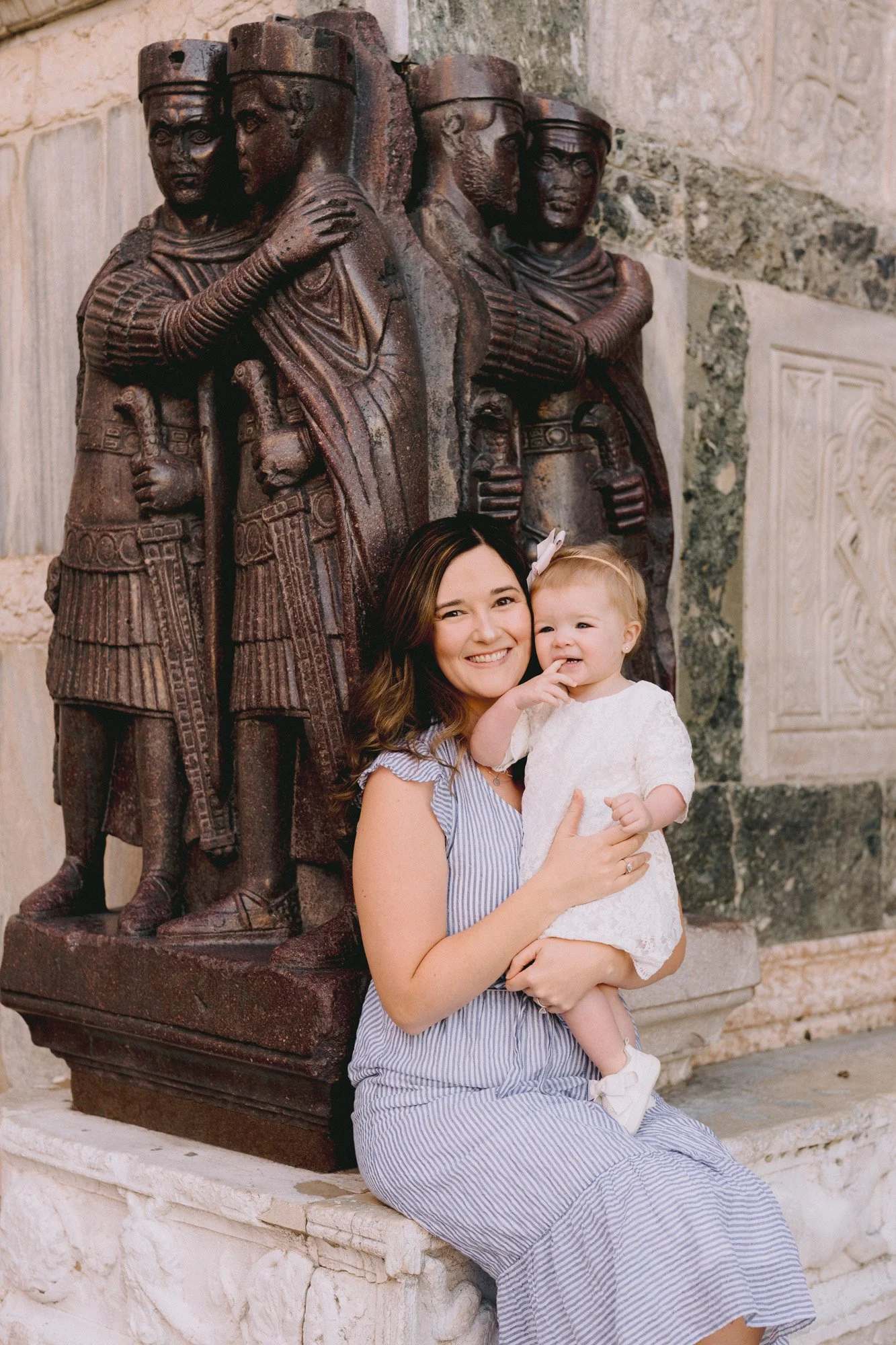 Mother and baby at the Tetrarchs statue