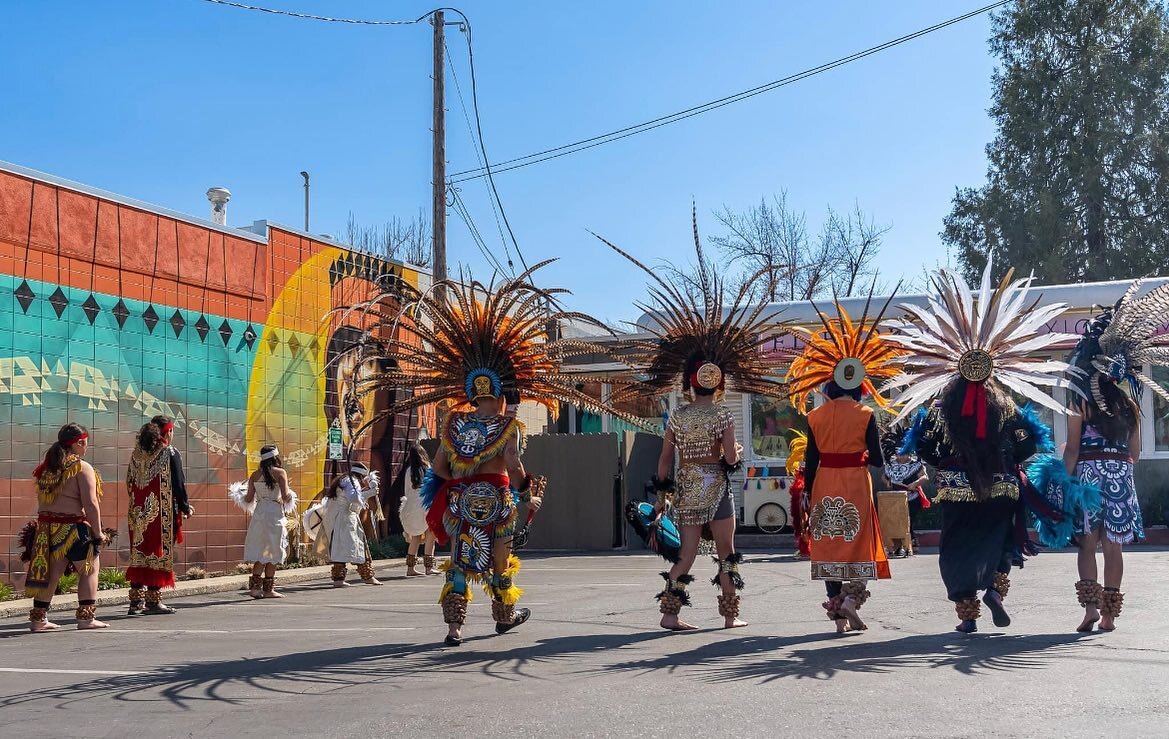 We have an exciting change of plans regarding the Aztec Dance performance! It will be taking place on the 21st, but the dancers will begin their performance on Mill Street, and perform all the way up to the El Barrio parking lot. The performance will