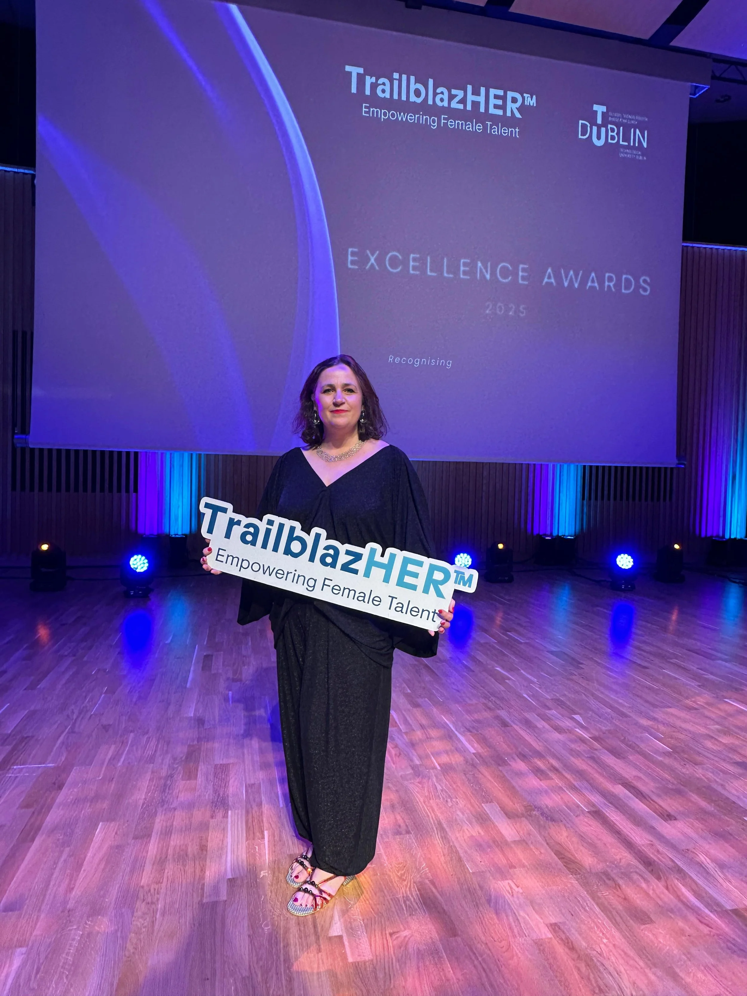 Lucy O'Reilly winning the TrailblazHER award for women returners.jpg