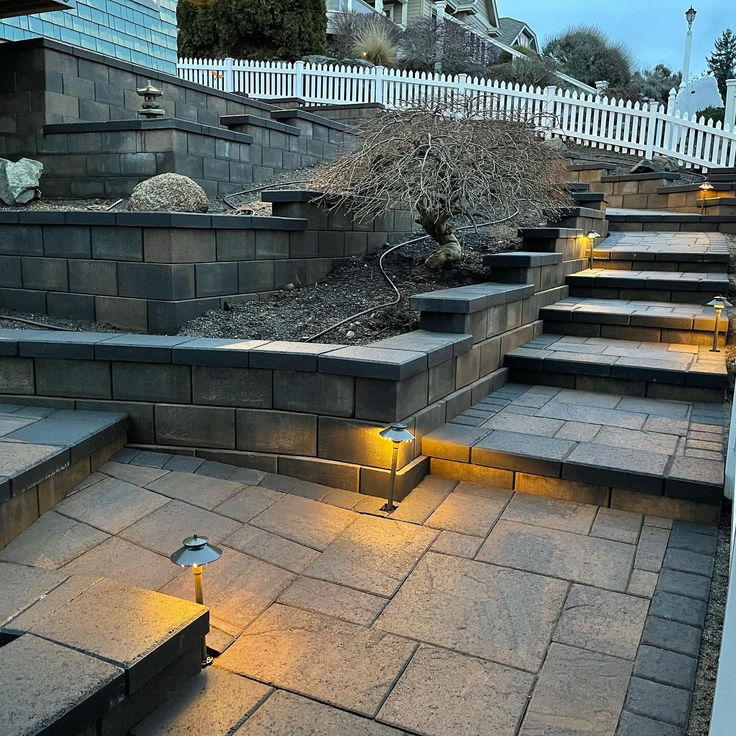 Before &amp; After of this amazing project we completed in Edmonds, WA - Landscape Lighting with La Pietra pavers in Columbia blend with Murata Walls in Olympian color. 

#hardscape #outdoorliving #pavers #retainingwall #walkway #landscapelighting #m