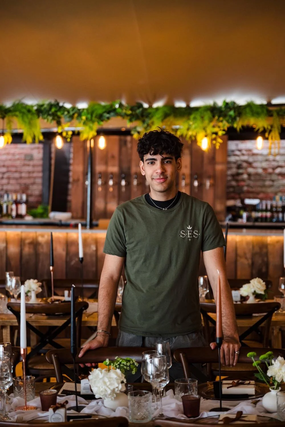 Zayn smiling as he sets up a wedding.