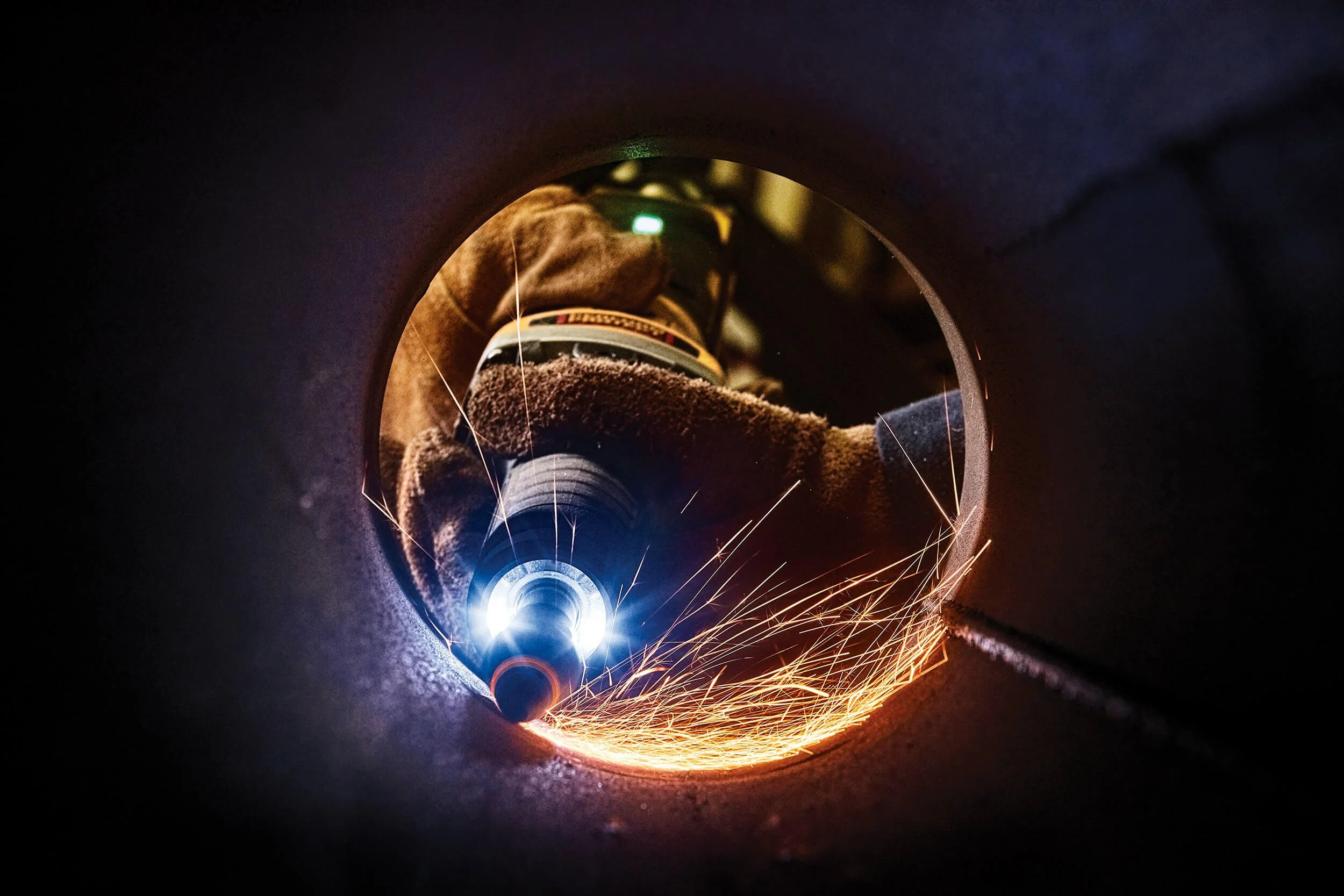 die-grinder-grinding-sparks-inside-pipe.jpg