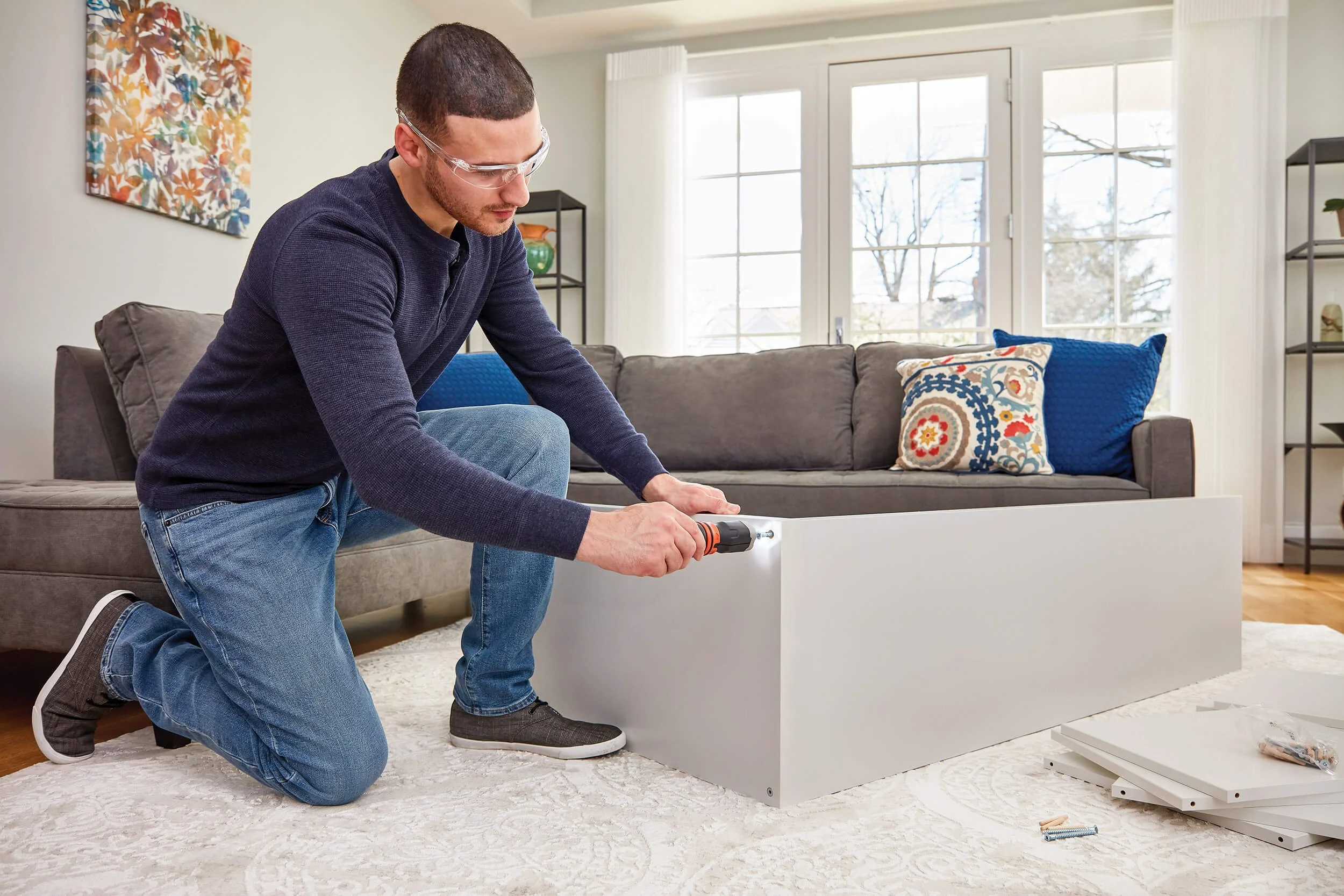 man-using-powered-screwdriver-assemble-furnature.jpg