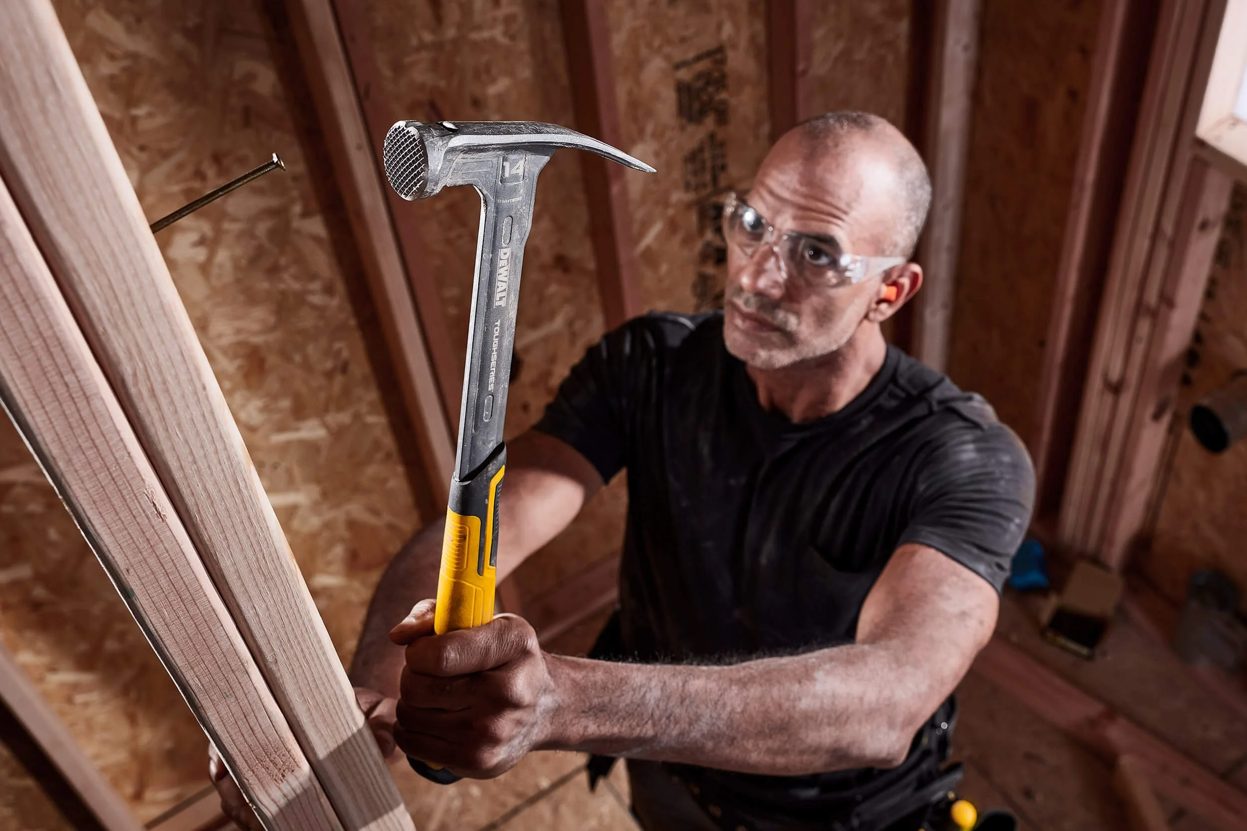 man-hammering-nail-in-wood-stud.jpg