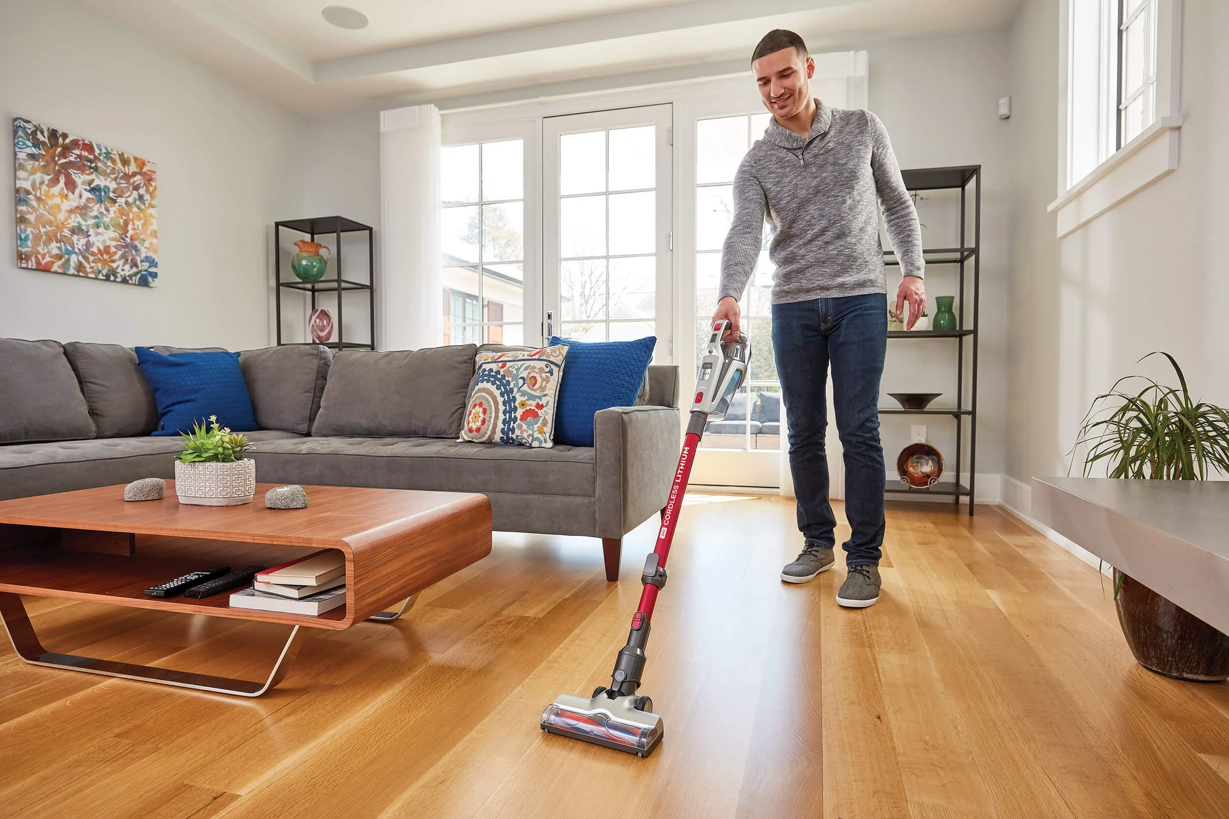 man-using-vacuum-living-room.jpg