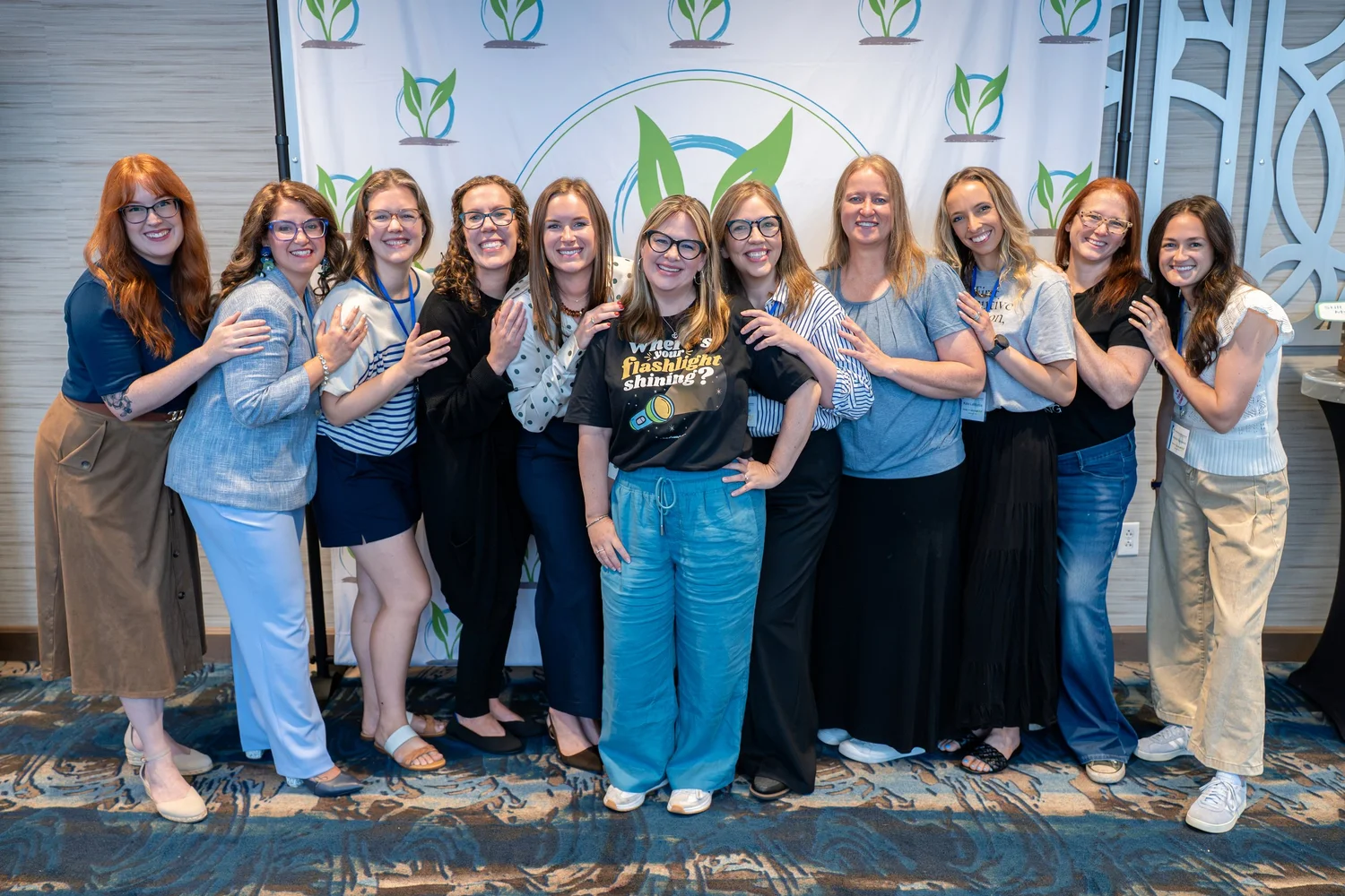 Seeds of Learning professionals posing together at an event