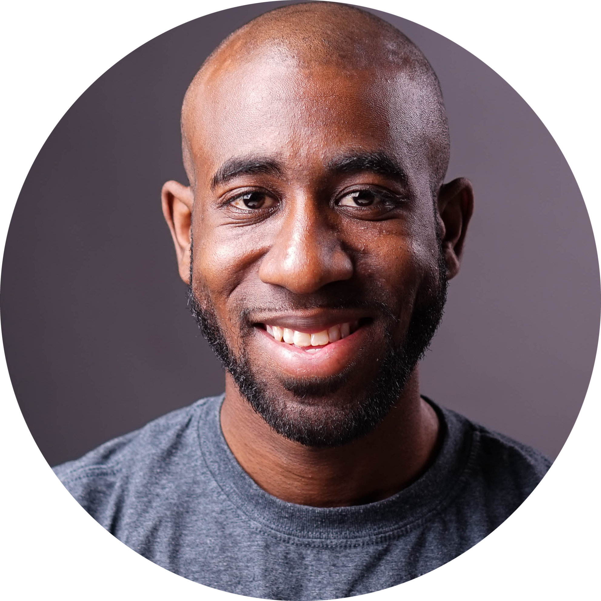 Bald African American man with beard smiling