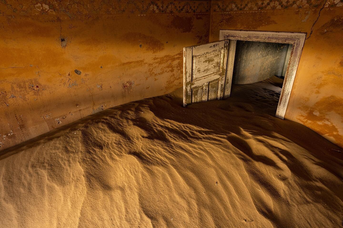 The mystical ruins of Kolmanskop, better known as the ghost town of Namibia. Once a thriving mining town, this area has been abandoned since 1956, with all structures soon succumbing to the harsh environmental elements.