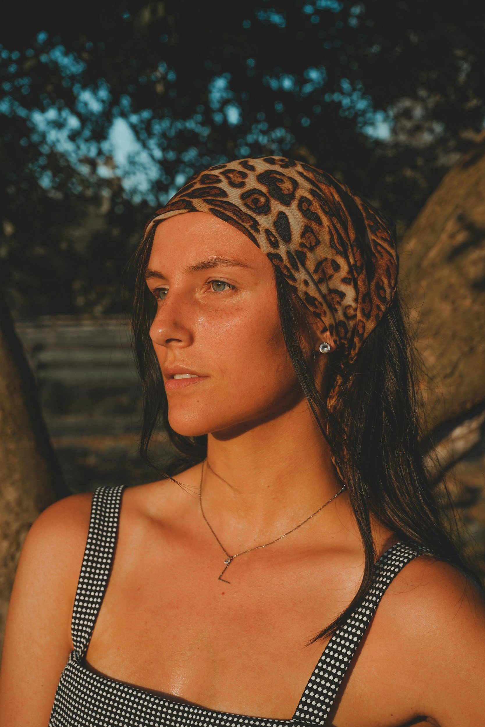 a woman standing in the summer heat.