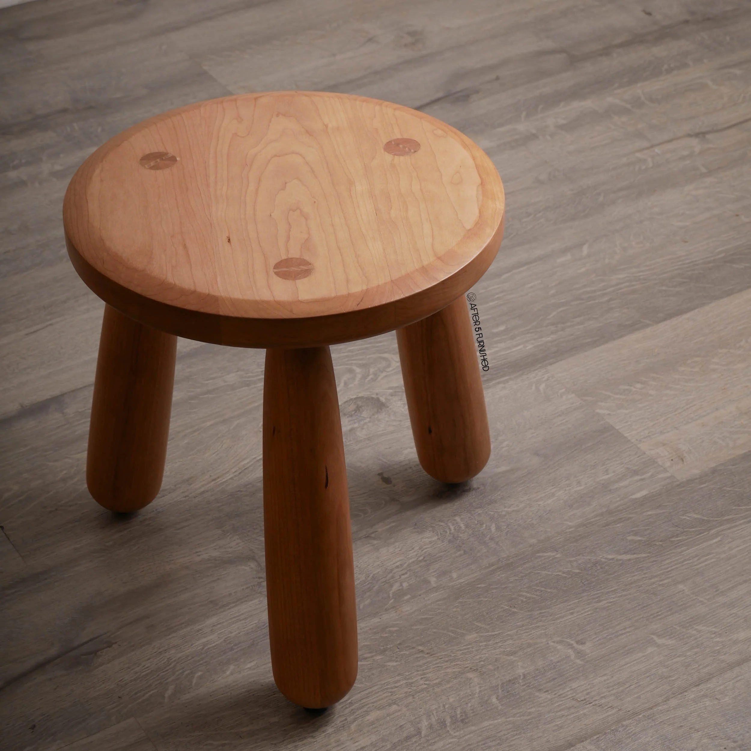 Contemporary handcrafted cherry stool with natural finish