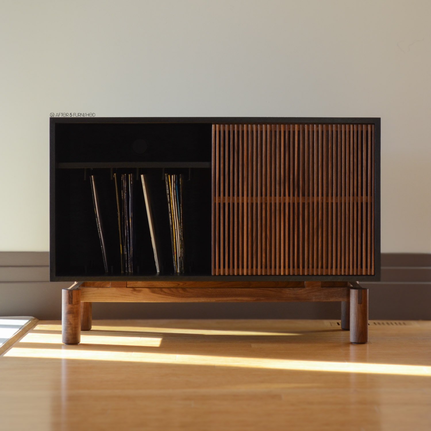 Handcrafted slatted walnut record cabinet designed with mid-century modern aesthetics and premium materials.
