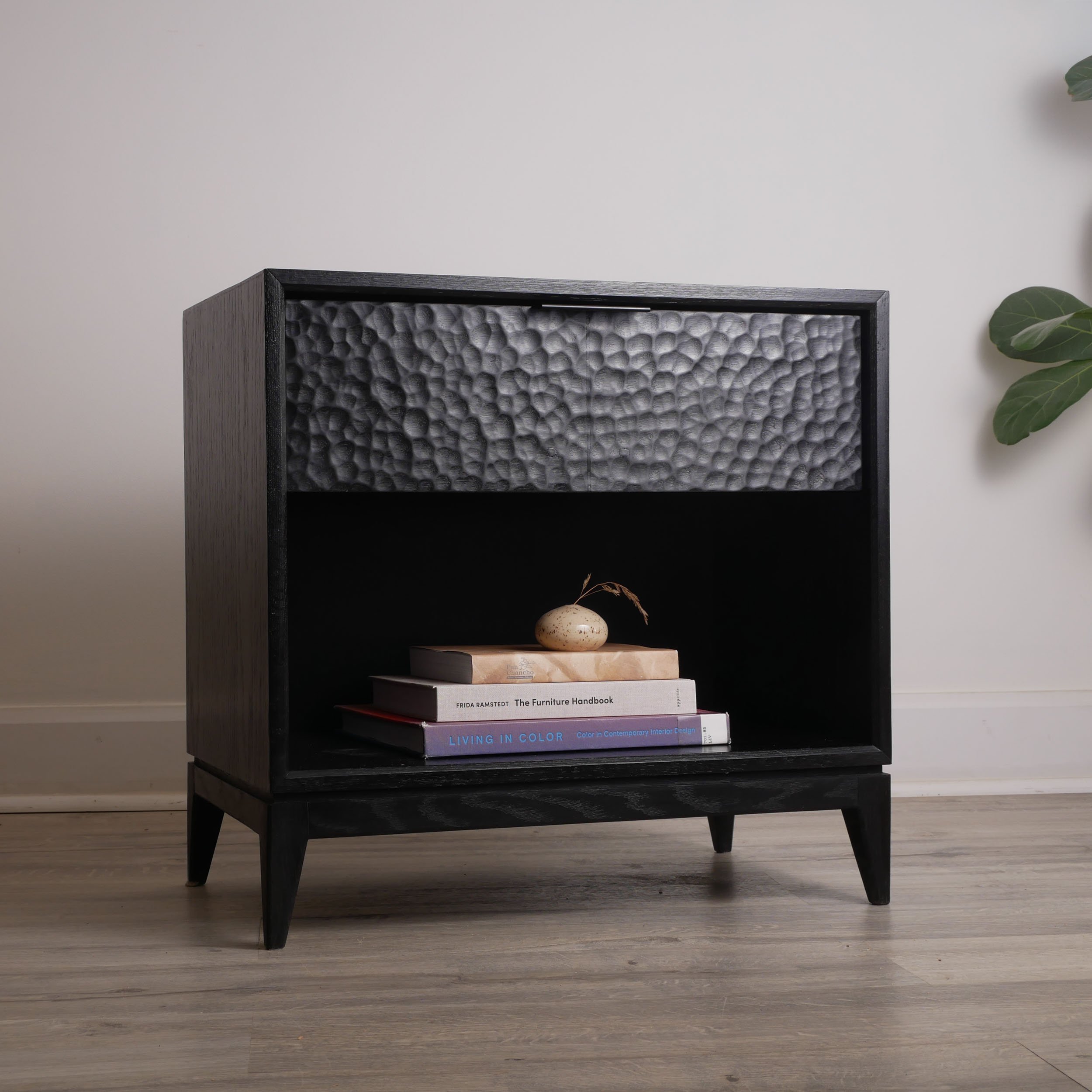 Modern Japandi black oak nightstand with sculptural textured surface, locally made Toronto furniture, minimalist bedroom design