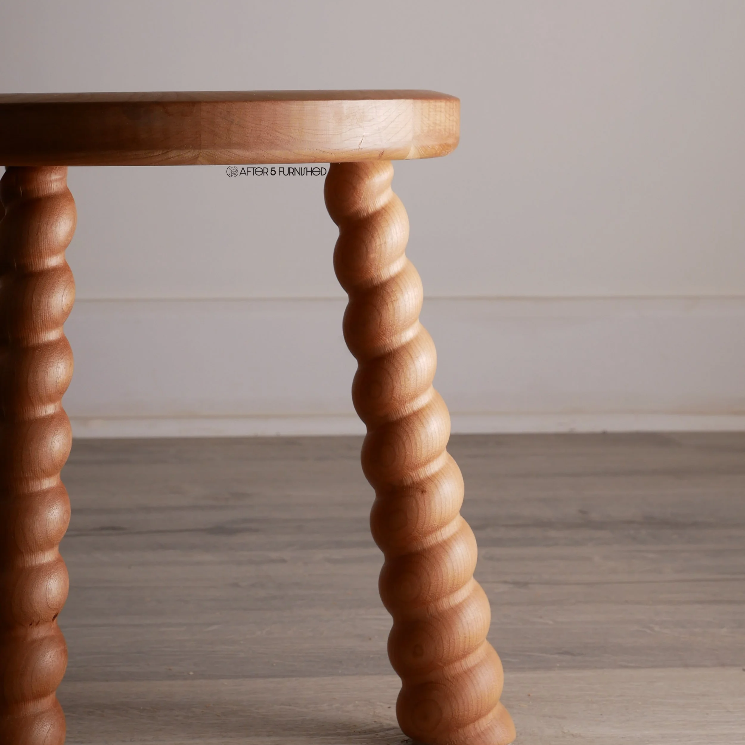 Mid-century inspired cherry wood footstool with round top