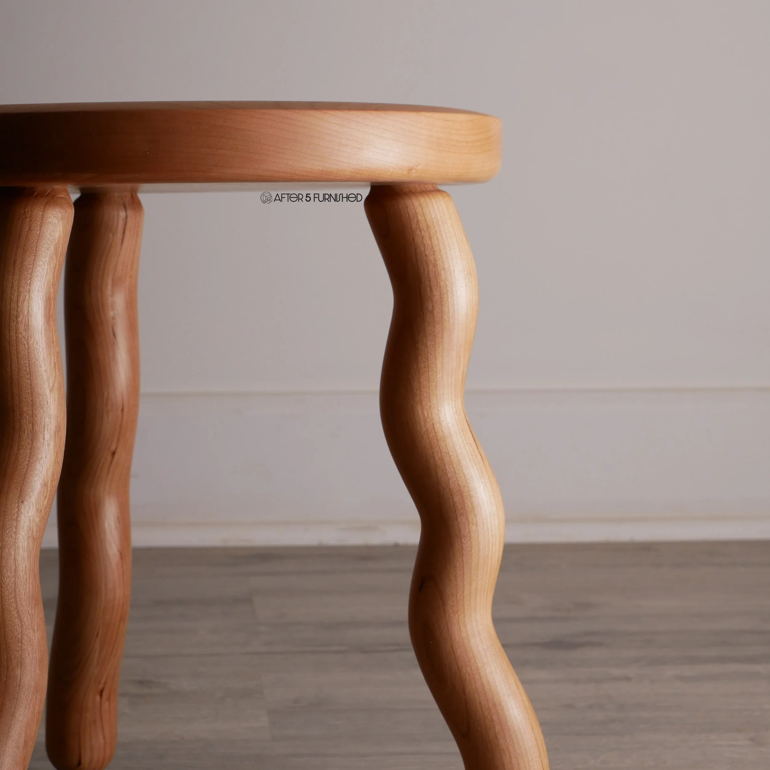 Playful solid wood stool with squiggly leg design