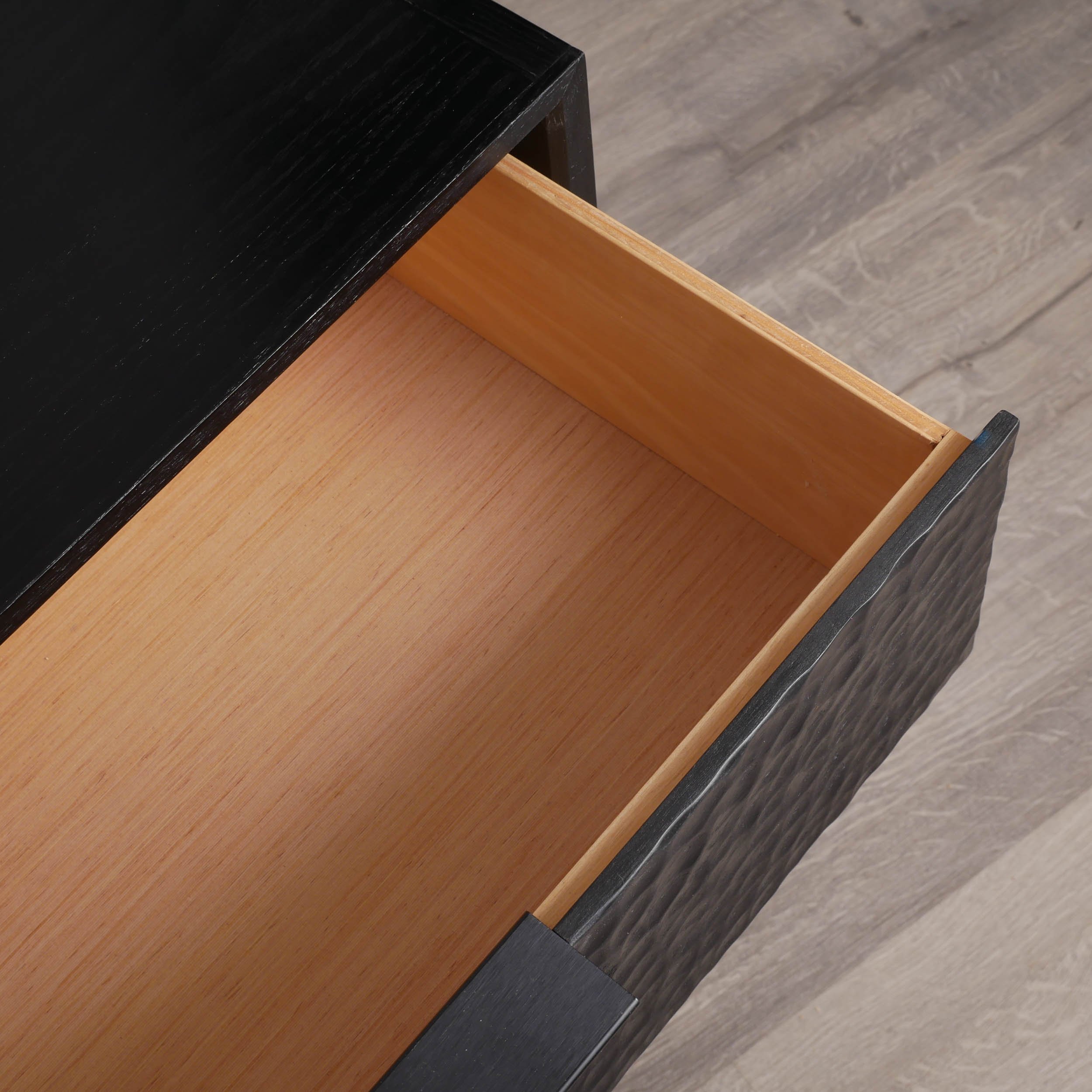 Minimalist black oak nightstand with textured drawer front and solid wood base, locally crafted Toronto furniture