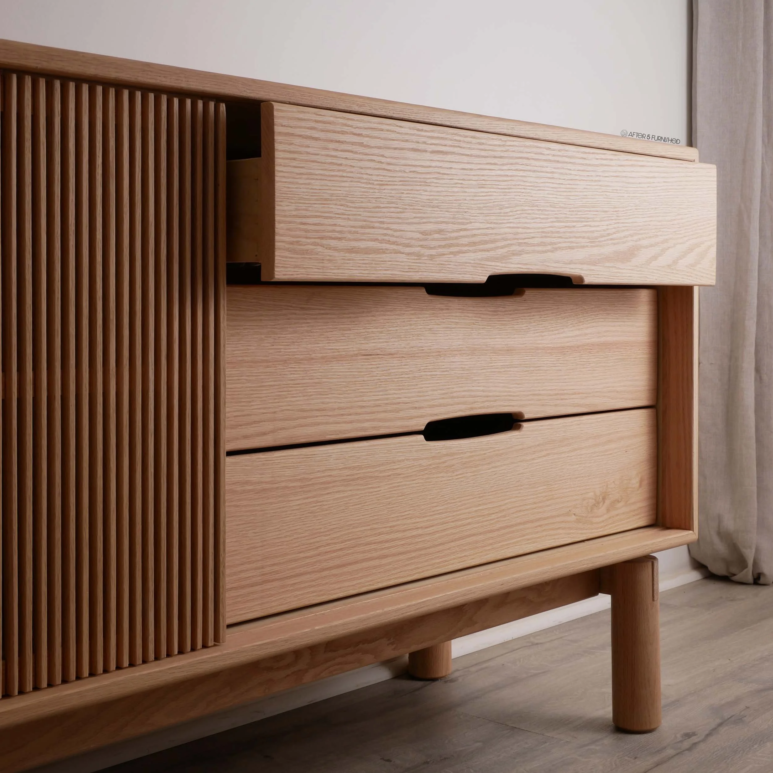 Locally made oak sideboard with fluted sliding panels, high-end Scandinavian minimalist furniture Toronto, custom wood credenza