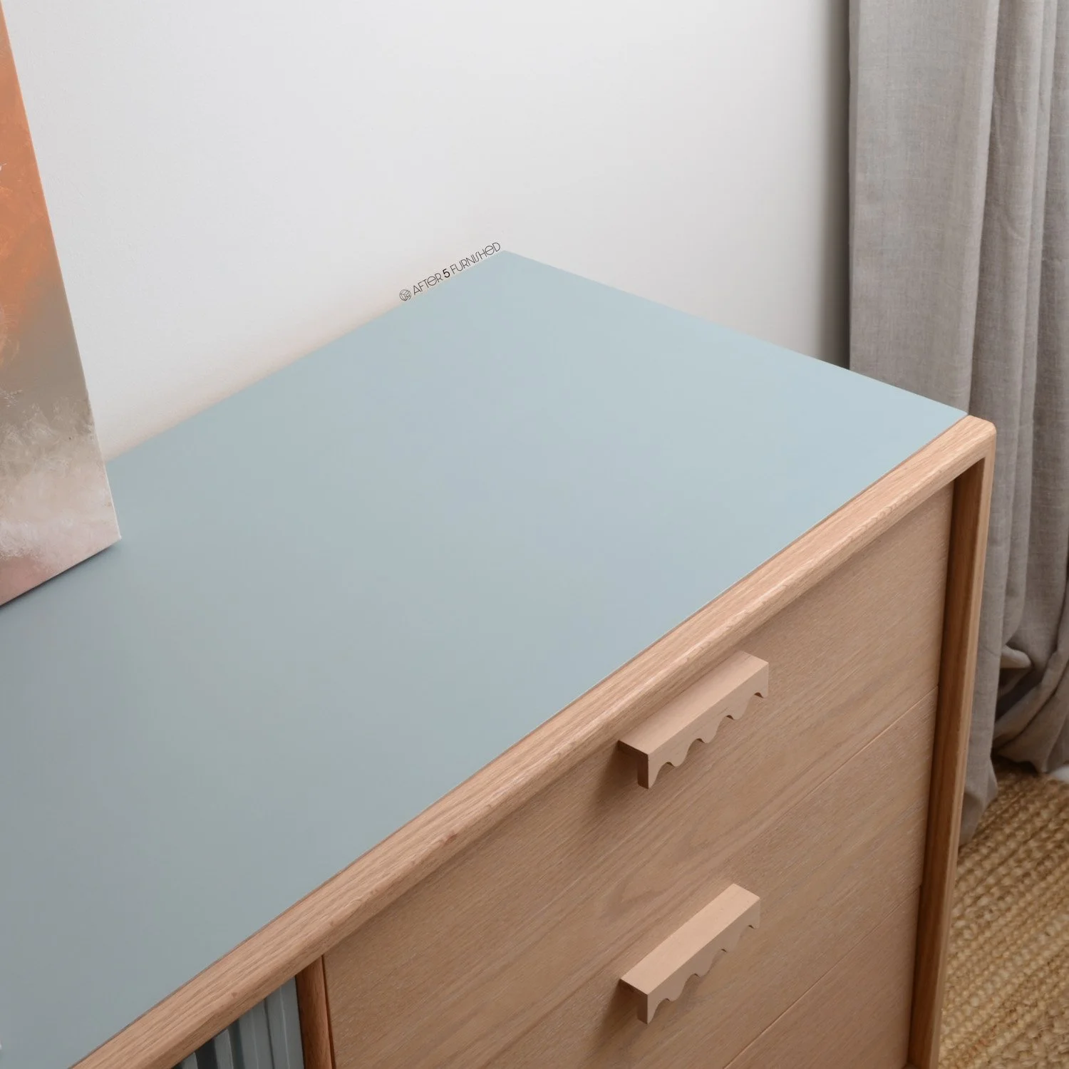 Modern blue nursery dresser styled in a minimal kids’ room