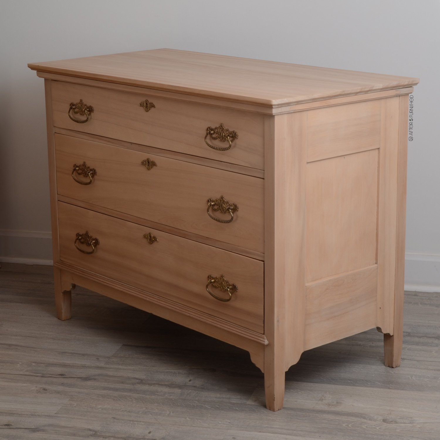 Side angle of 19th century solid wood dresser restored in Toronto