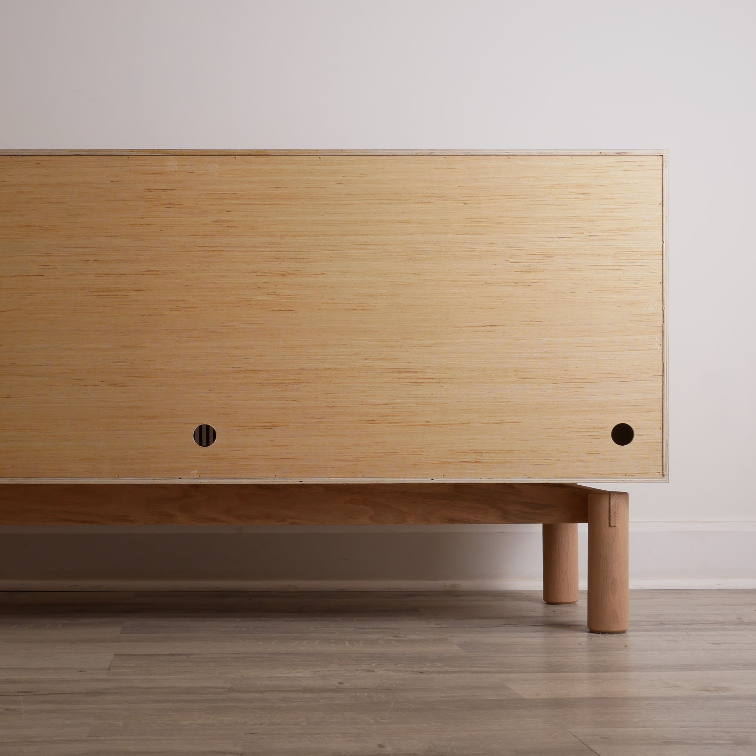 Minimalist oak storage cabinet with sliding slatted doors, high-quality handcrafted furniture Toronto, Scandinavian-inspired credenza