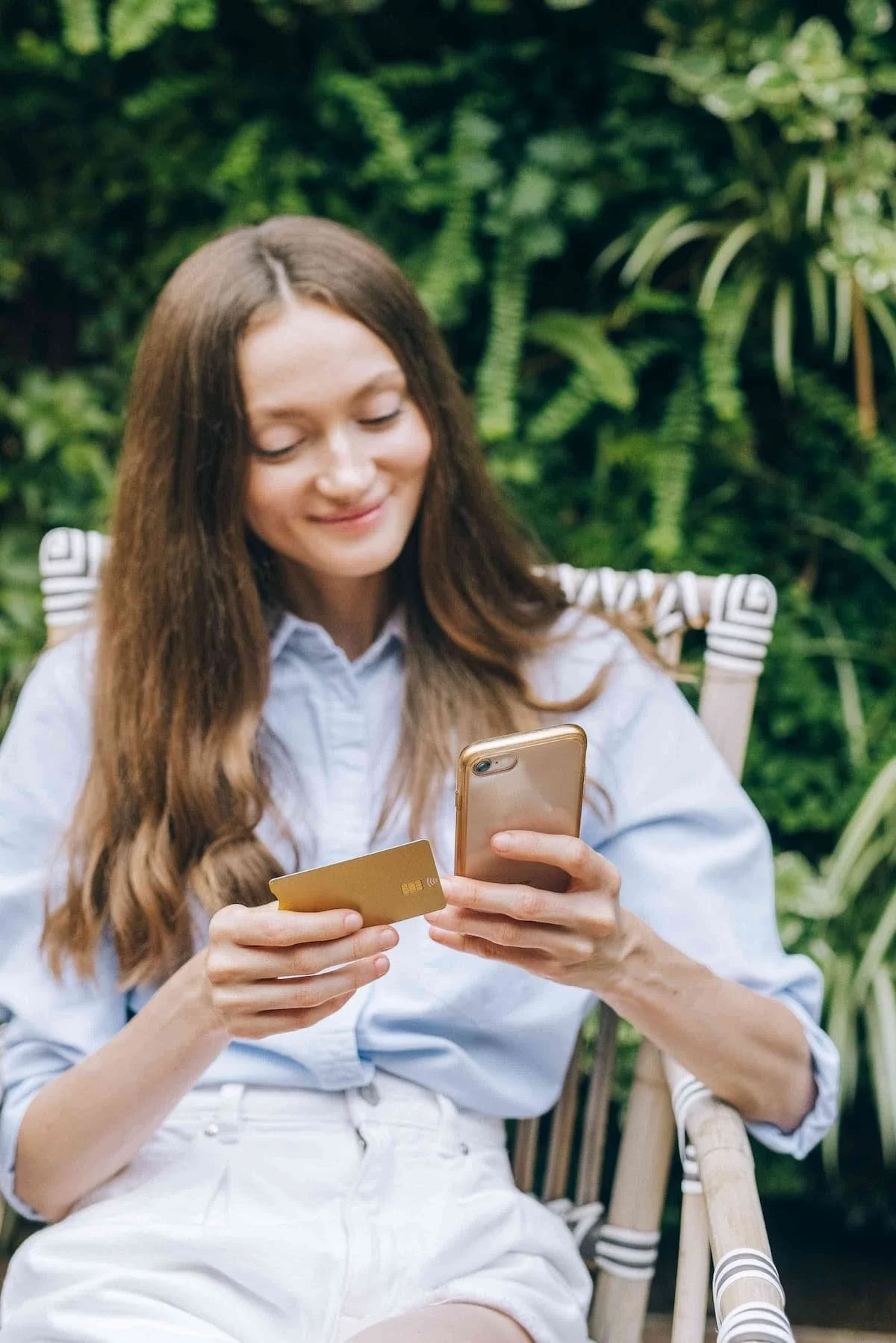 girl looking at phone on vacation