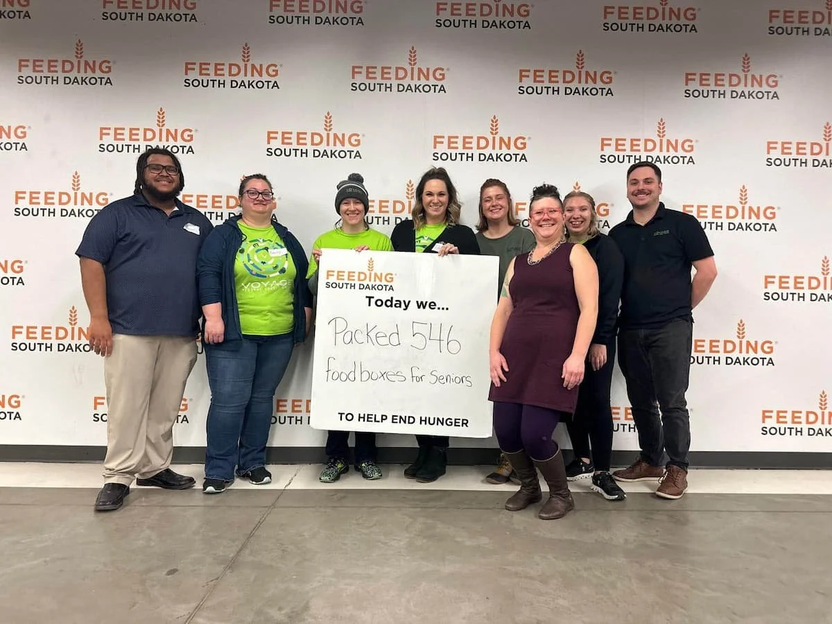 Voyage FCU team members backing food boxes for Feeding South Dakota in Sioux Falls, SD.