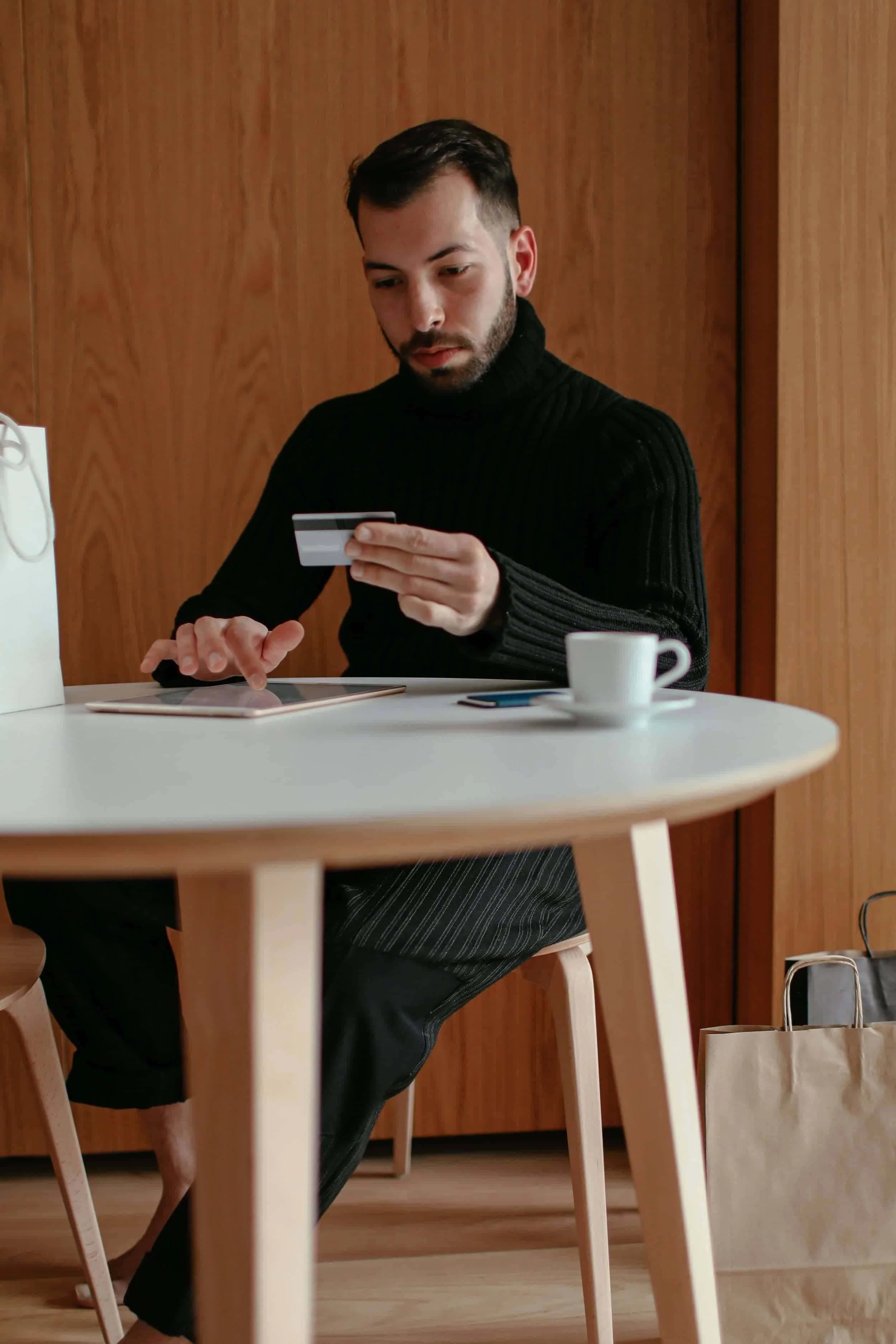 A man with a credit card in his hand