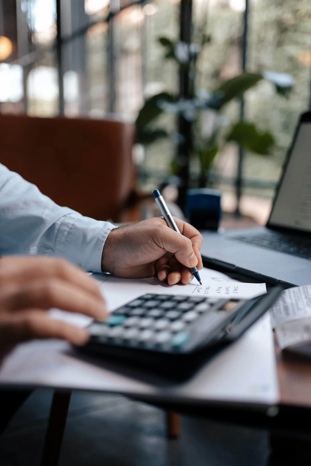 calculator and laptop man working numbers