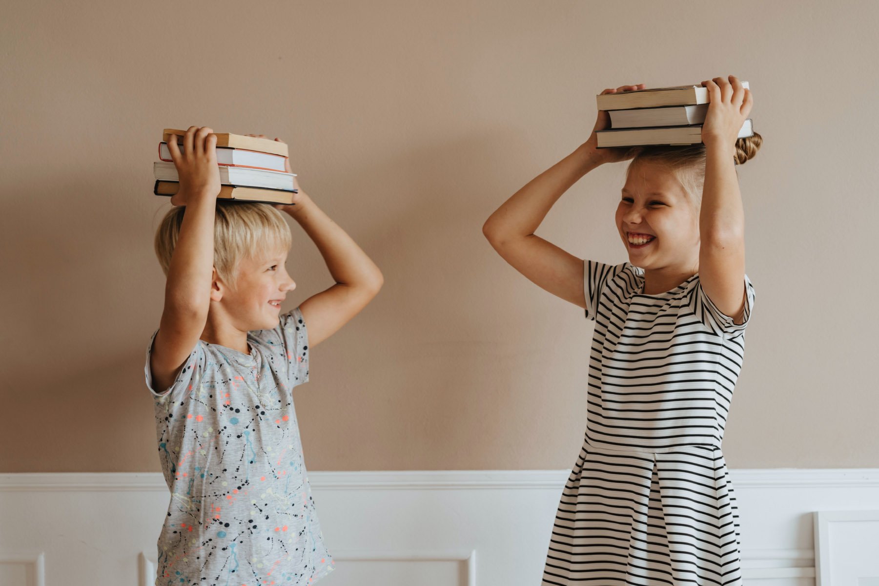 kids with books on their head