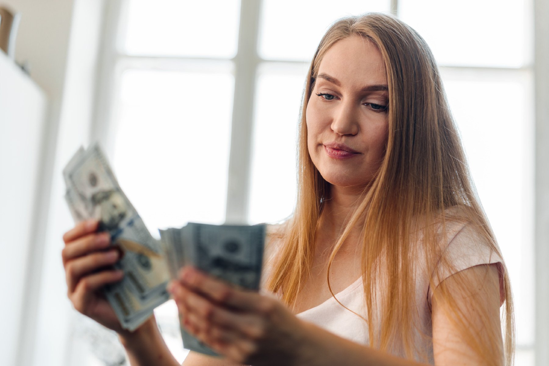 Woman sorting through money